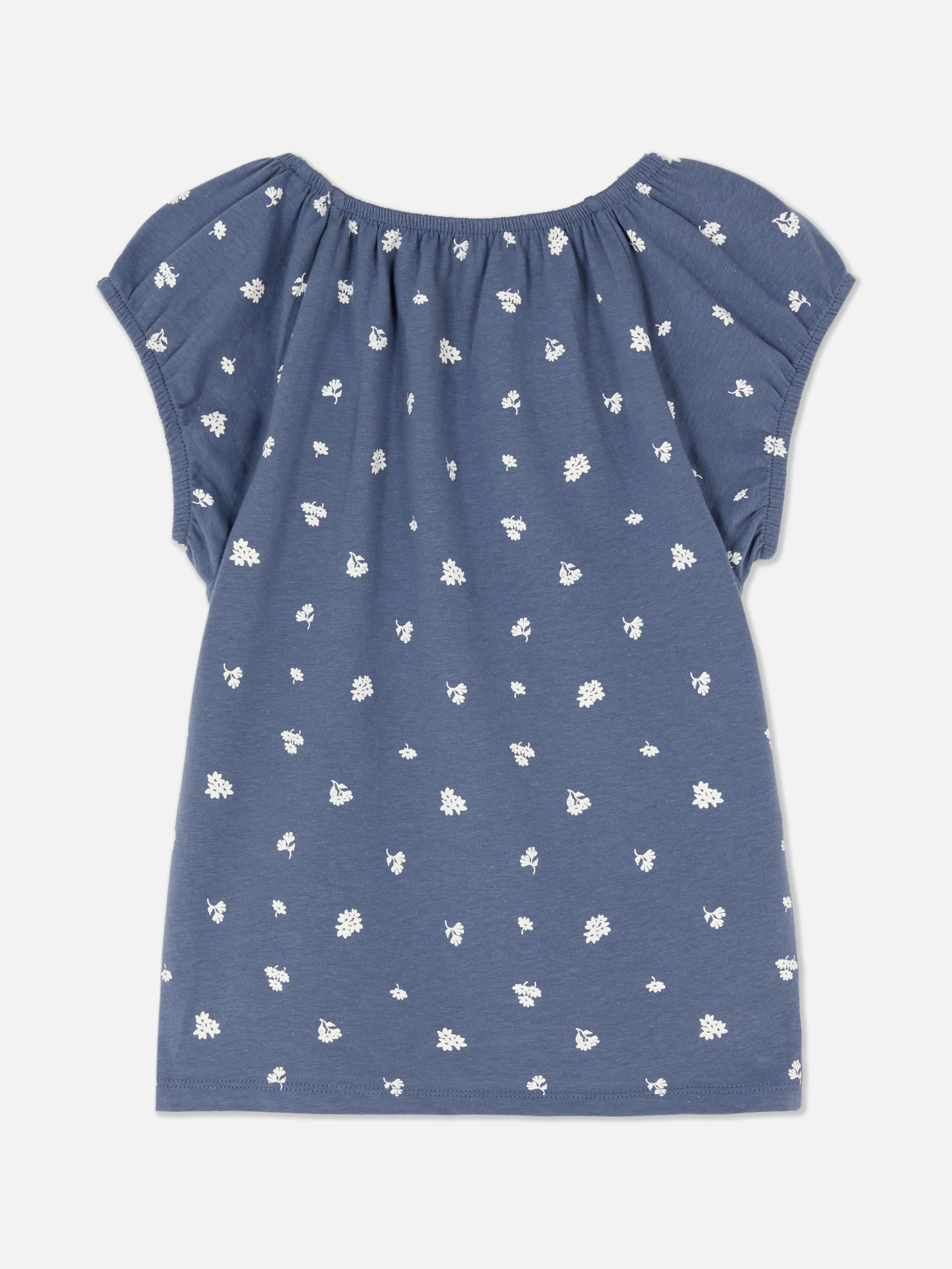 Camiseta con estampado floral y hombros descubiertos