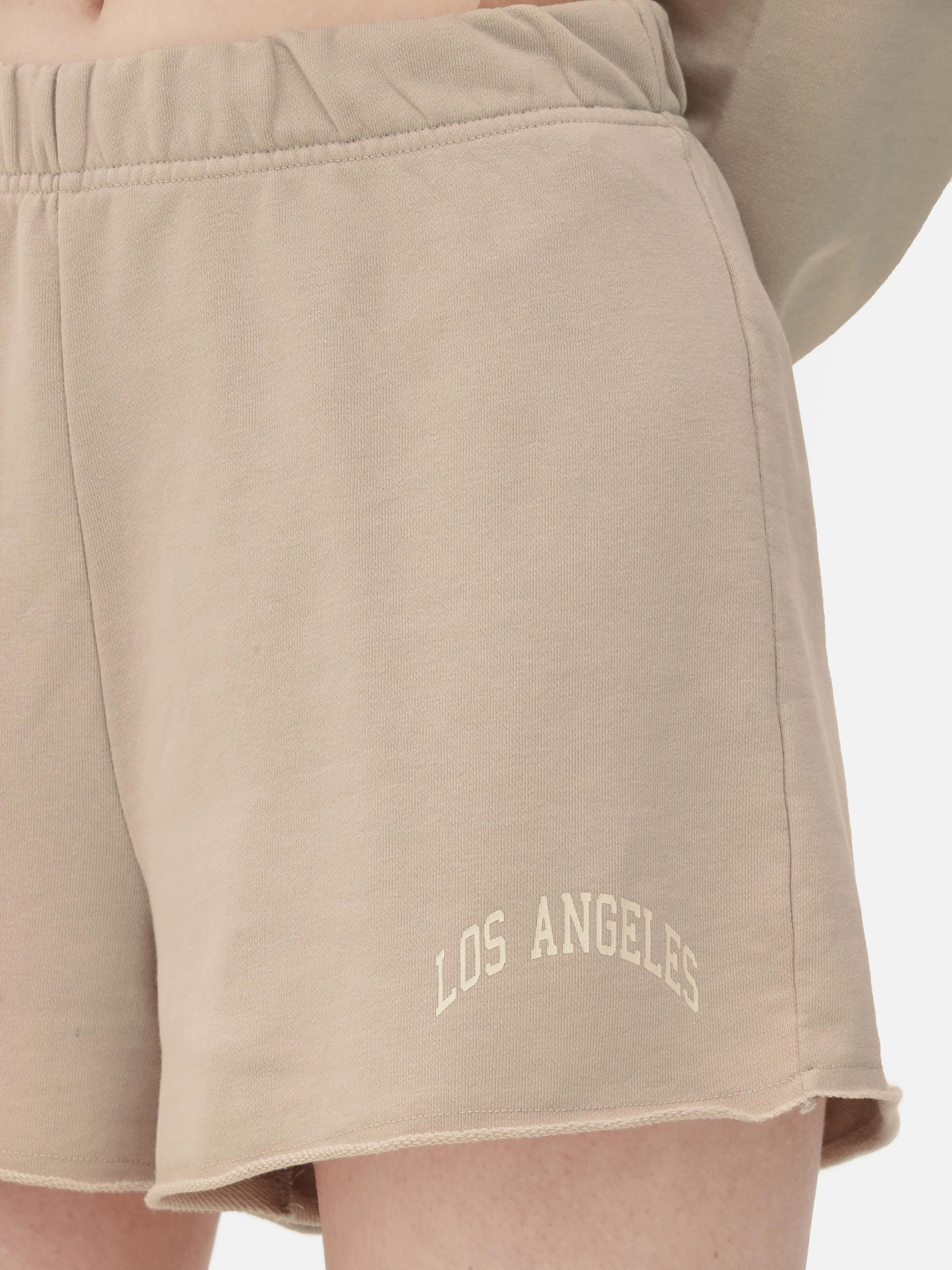 Pantalones cortos combinables con bajo sin rematar